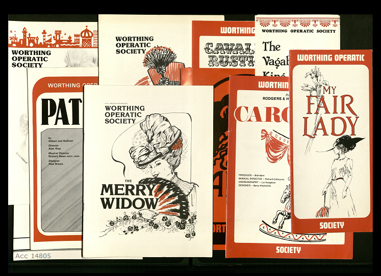 A collage of programmes for various musicals. They are in a red, white and black colour scheme against a black background.